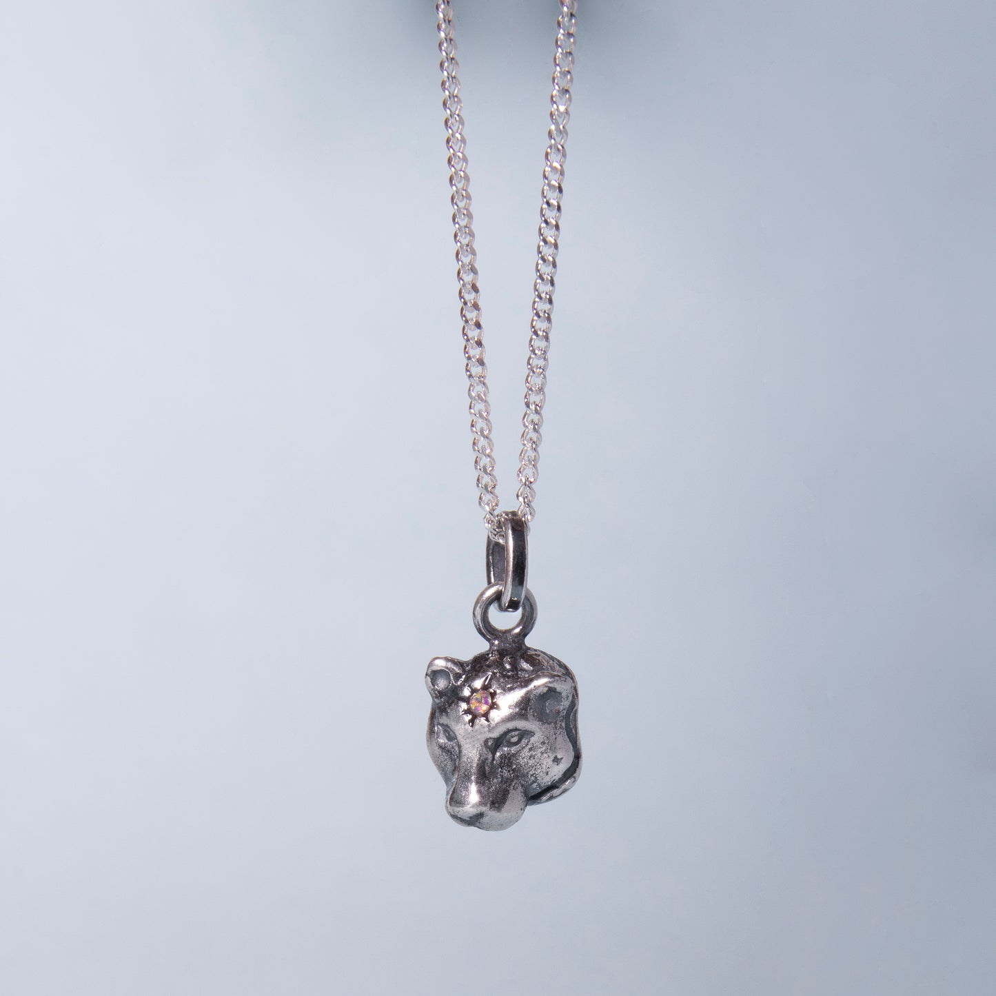 Dije carita de jaguar